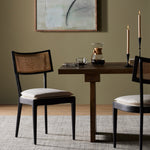 Mixed materials refresh retro dining style. Ebony-finished nettlewood frames a textural inlay of natural cane, for perfect contrast. Fastened by Velcro, high-performance linen-blend seating for modern sensibility. Performance fabrics are specially created to withstand spills, stains, high traffic and wear, ensuring long-term comfort and unmatched durability. Amethyst Home provides interior design, new construction, custom furniture and area rugs in the Oklahoma City metro area