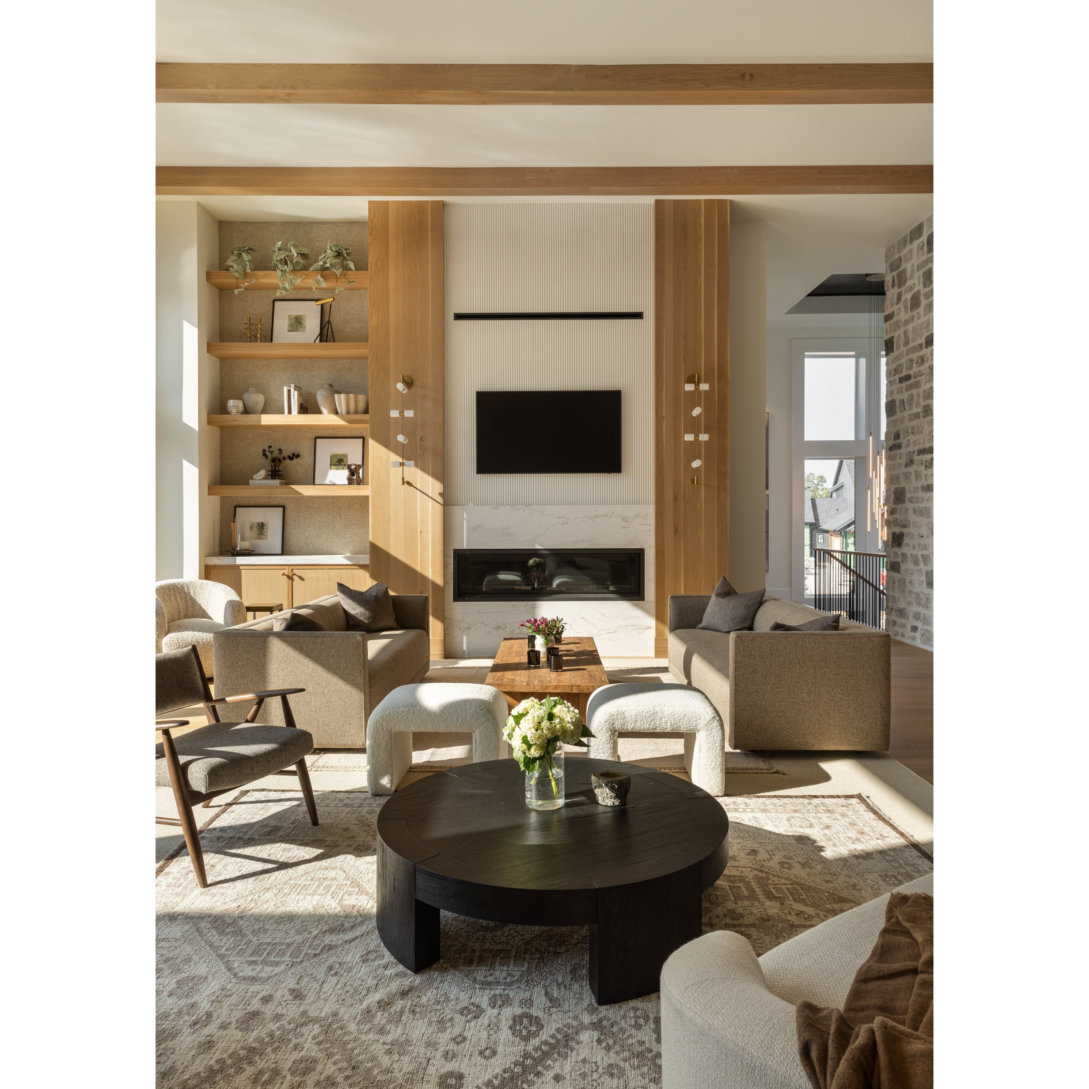 Made from thick, charcoal-finished oak, a rounded coffee table features four legs that pull through to the top, for an intriguing design detail.Overall Dimensions: 48.00"w x 48.00"d x 13.00"hWeight : 94.80 lbsMaterials : Oak Veneer Amethyst Home provides interior design, new home construction design consulting, vintage area rugs, and lighting in the Nashville metro area.