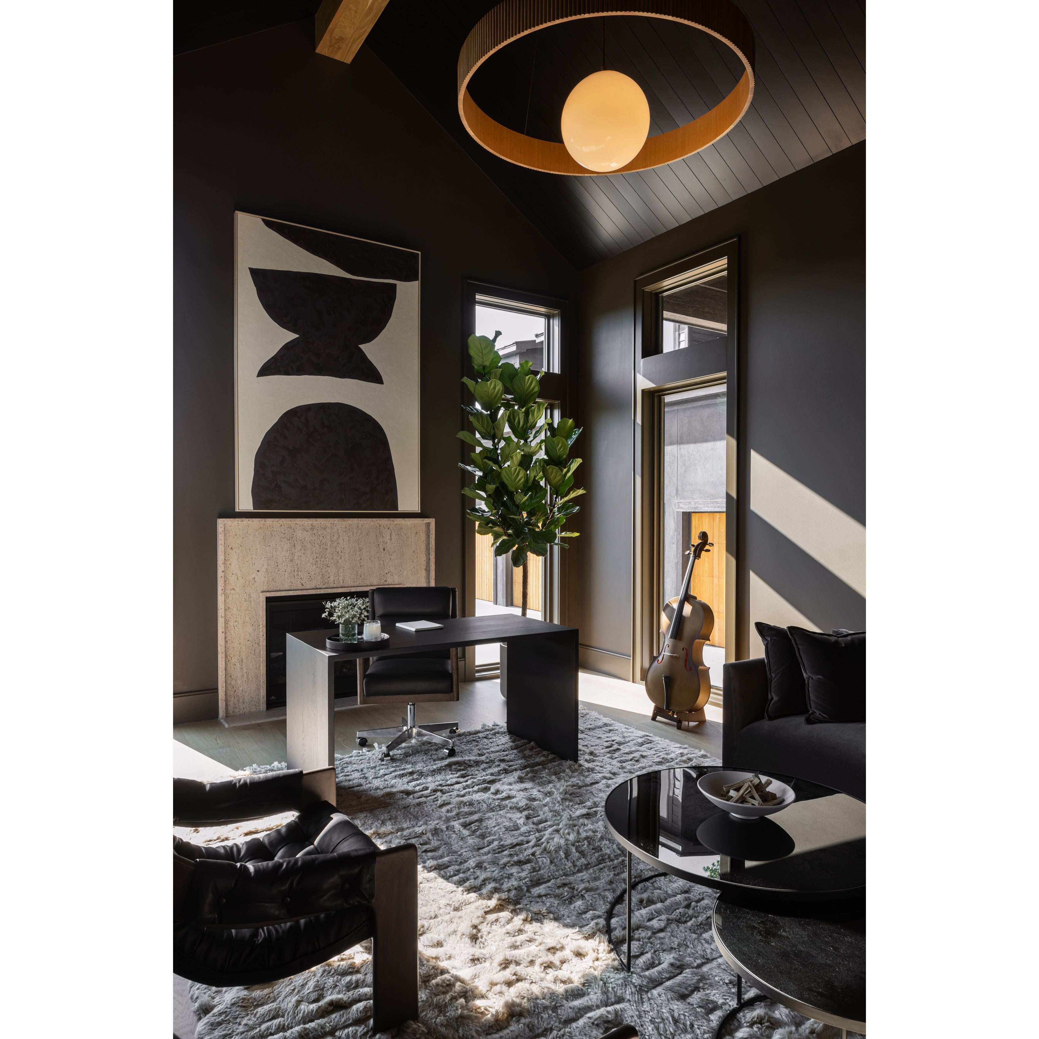 An Amethyst fave -- the Levi Black Leather Desk Chair is modern yet inviting.  Gorgeous black leather with a sleek side profile, this desk chair will elevate your office. Amethyst Home provides interior design, new home construction design consulting, vintage area rugs, and lighting in the Alpharetta metro area.