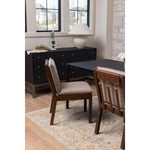An Amethyst fave -- the Wilmington dining chair has a gorgeous coffee colored textile paired with medium toned wood and interesting leather buckles on the back -- we tied in the gold buckles with the gold chandelier above!  Inspired by the folded pillow form, the seat and back cushions of this parawood dining chair are covered in performance fabric. Amethyst Home provides interior design, new home construction design consulting, vintage area rugs, and lighting in the Washington metro area.