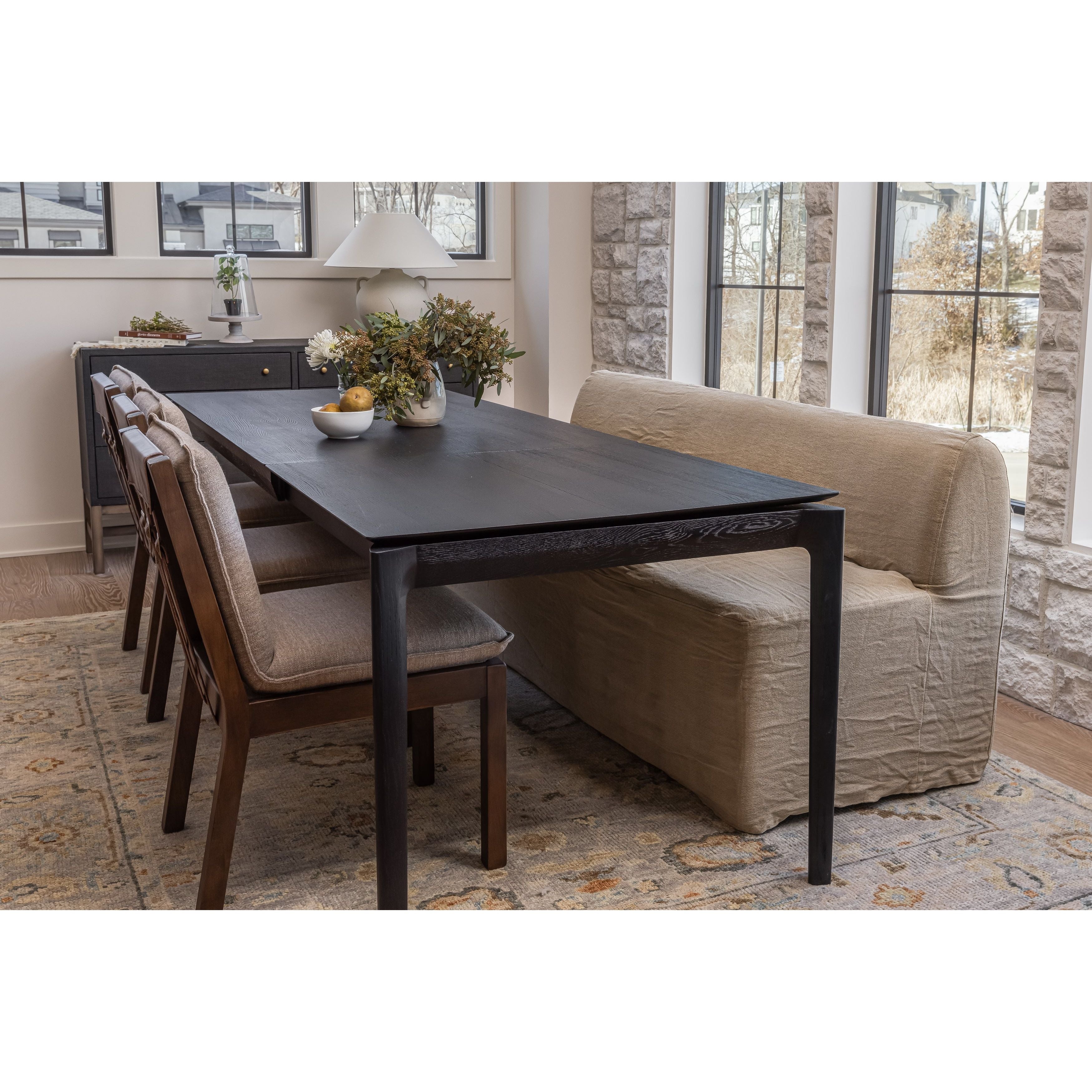 An Amethyst fave -- the Wilmington dining chair has a gorgeous coffee colored textile paired with medium toned wood and interesting leather buckles on the back -- we tied in the gold buckles with the gold chandelier above!  Inspired by the folded pillow form, the seat and back cushions of this parawood dining chair are covered in performance fabric. Amethyst Home provides interior design, new home construction design consulting, vintage area rugs, and lighting in the Newport Beach metro area.