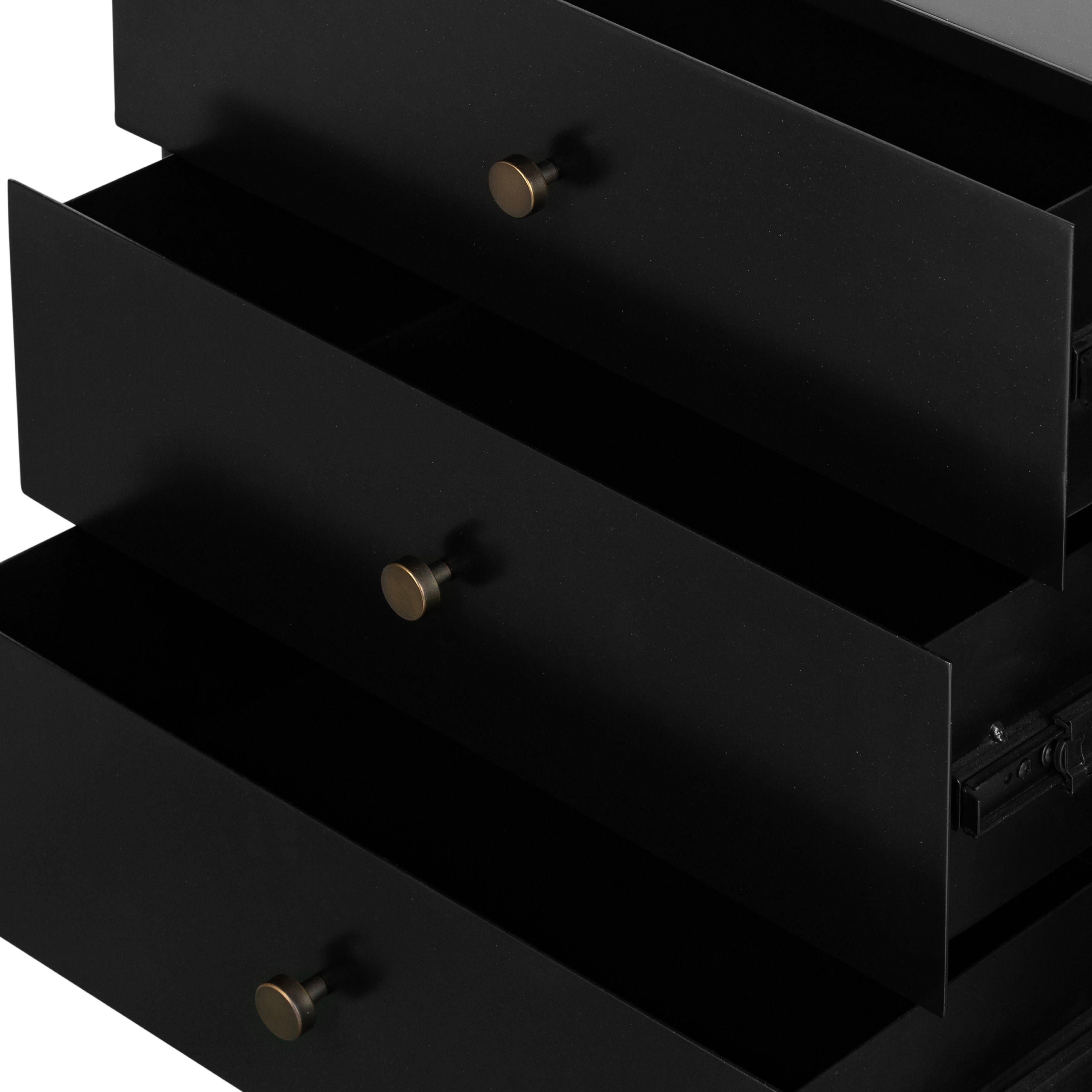 Bring a clean, beautifully industrial look to the bedroom with a three-drawer dresser made from black-finished iron, featuring bronzed iron hardware.
