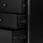 Bring a clean, beautifully industrial look to the bedroom with a three-drawer dresser made from black-finished iron, featuring bronzed iron hardware.