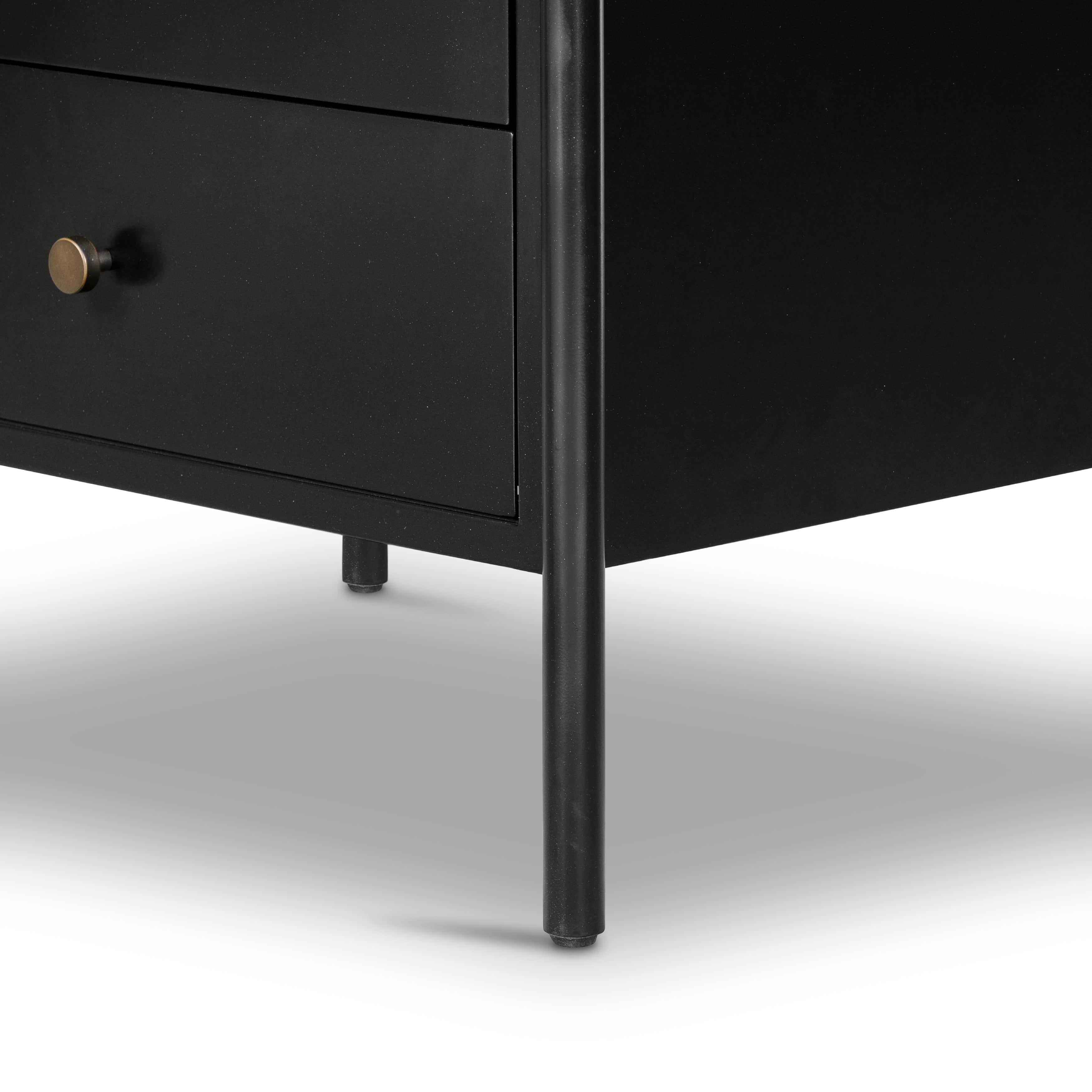Bring a clean, beautifully industrial look to the bedroom with a three-drawer dresser made from black-finished iron, featuring bronzed iron hardware.
