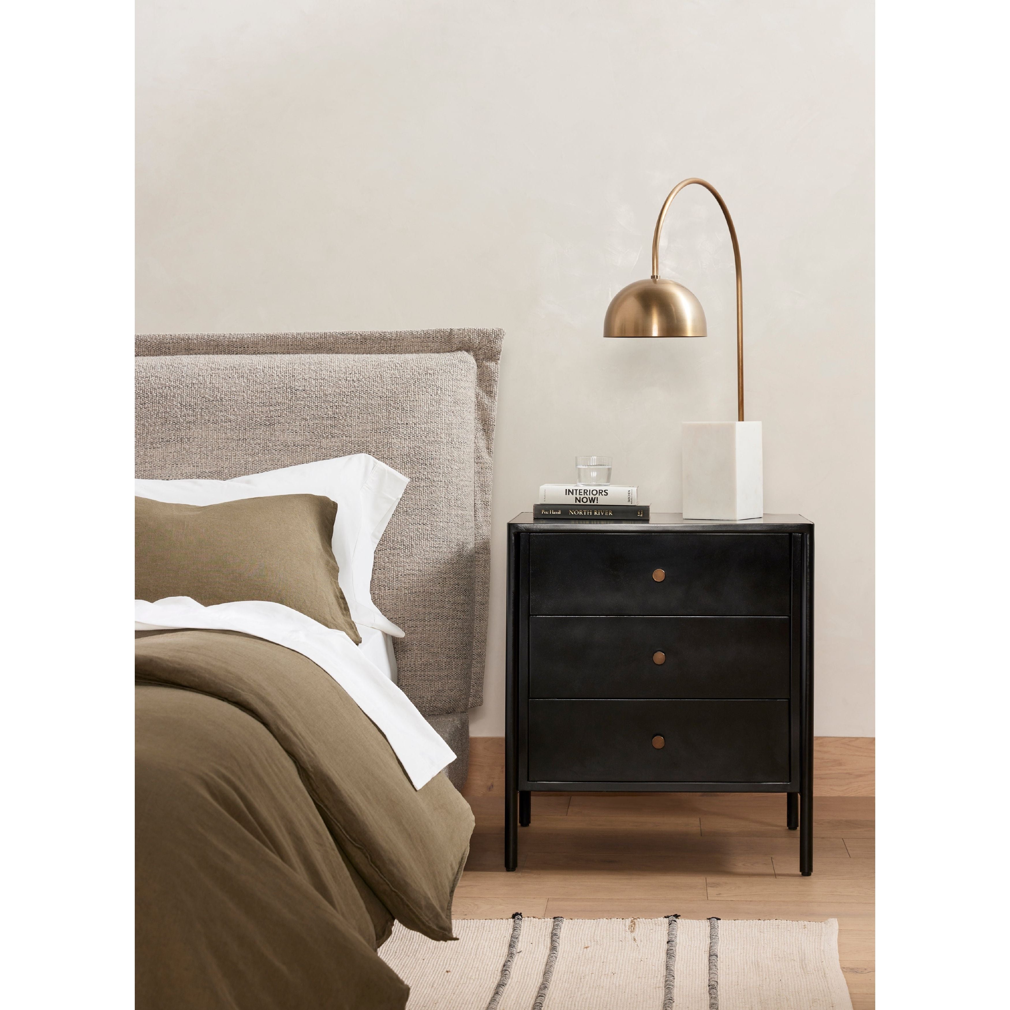 Bring a clean, beautifully industrial look to the bedroom with a three-drawer dresser made from black-finished iron, featuring bronzed iron hardware.