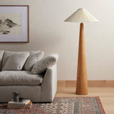 Modern minimal meets traditional. A tapered wood floor lamp base is topped with a design-forward pleated shade. Amethyst Home provides interior design, new home construction design consulting, vintage area rugs, and lighting in the Kansas City metro area.