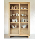 Featuring Wave Oak Cupboard by Ethnicraft at Amethyst Home. The subtle contours of the cabinet doors and the distinguished shape of the feet are what make the Wave collection so special. Made of solid wood, this storage cupboard’s doors and drawers have no handles and feature a soft closing mechanism.Weight : 256 lbs Dimensions: 18.5" W x 43.5" L x 72.5" H.  Amethyst Home provides interior design, new home construction design consulting, vintage area rugs, and lighting in the Houston metro area.
