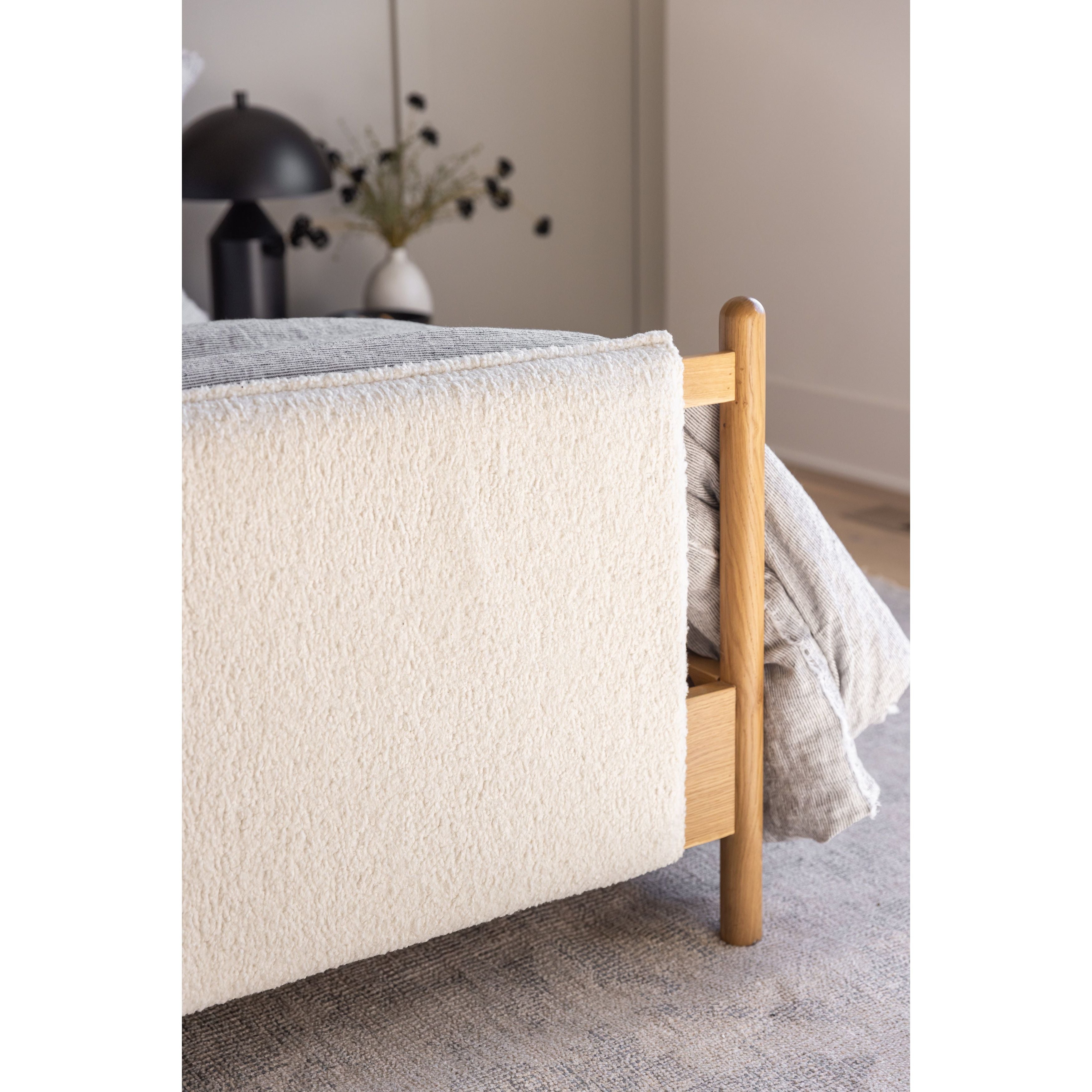 Bring a cozy hygge vibe to the bedroom with this textured Bowen Bed. Framed by light-finished solid oak, a sling-style bed features faux shearling head and foot boards -- sure to elevate any bedroom. Amethyst Home provides interior design, new home construction design consulting, vintage area rugs, and lighting in the Salt Lake City metro area.