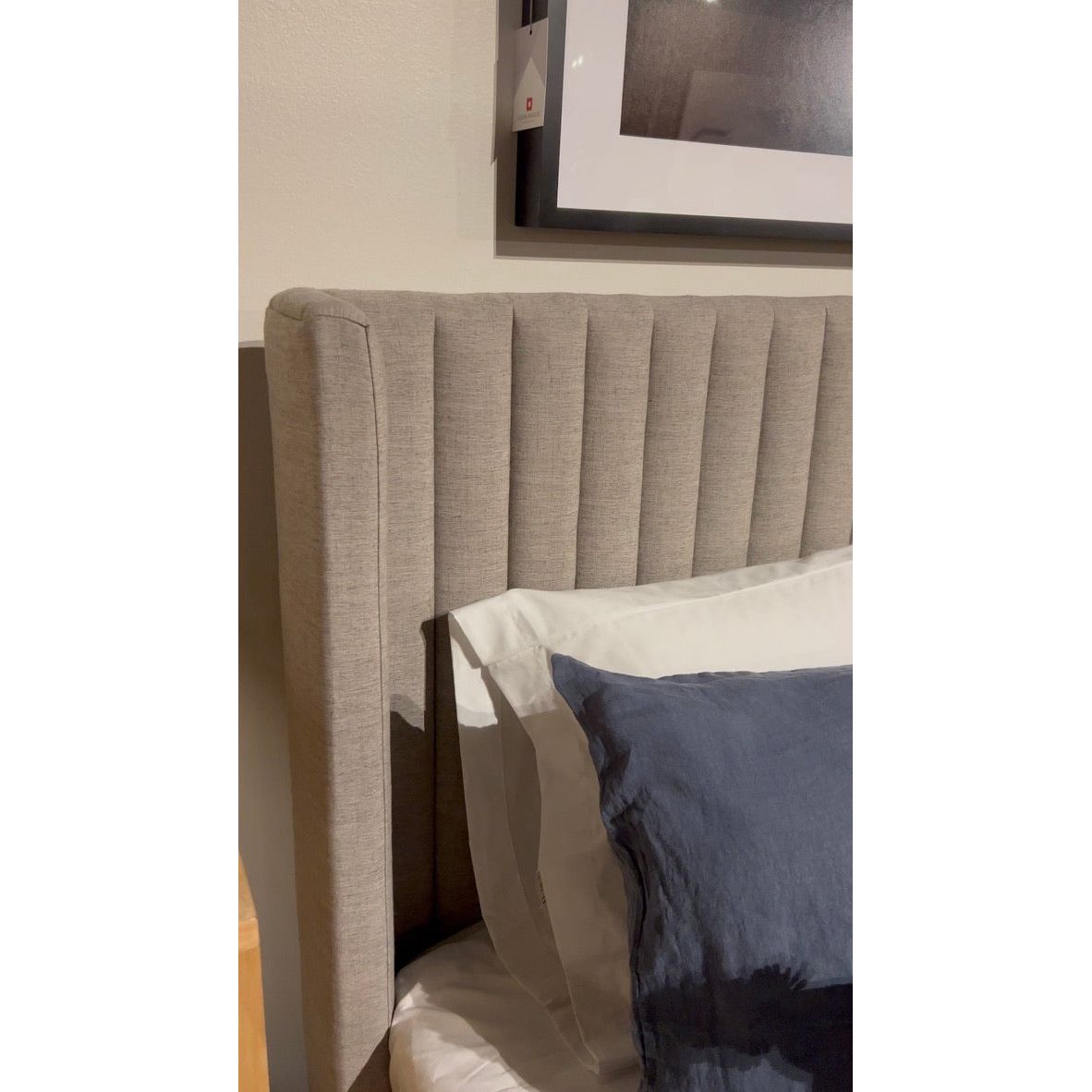 The Montgomery Bed is a tall, vertical-channeled headboard that is upholstered in grey high-performance fabric for a sensible take on modern bedroom styling. A parawood plinth base grounds the whole look. Performance fabrics are specially created to withstand spills, stains, high traffic and wear, ensuring long-term comfort and unmatched durability. Amethyst Home provides interior design, new home construction design consulting, vintage area rugs, and lighting in the Charlotte metro area.