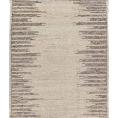 Featuring Alpine Patra Hand-Knotted Rug by Jaipur Living at Amethyst Home. Inspired by textiles from the Tullu region in Morocco, the Patra area rug showcases a linear design in neutral shades of cream, taupe, brown, and gray. This high-piled accent lends warmth and comfort to any space with durable wool hand-knotted onto a cotton foundation. Braided fring. Amethyst Home provides interior design, new home construction design consulting, vintage area rugs, and lighting in the Washington metro area.