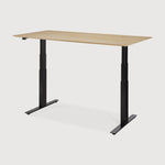 Featuring Bok Black Us Oak Adjustable Desk by Ethnicraft at Amethyst Home. The Bok adjustable desk was designed with the importance of health and good posture in mind. The motorised system in its legs allows the tabletop to be elevated to the height of your liking. That way, you can easily switch between sitting and standing throughout the workday. Choose between white or black m. Amethyst Home provides interior design, new construction, custom furniture, and area rugs in the Des Moines metro area