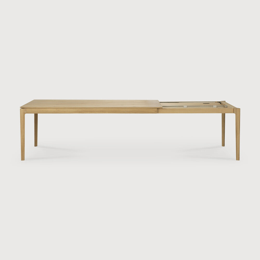 Featuring Bok Oak Rectangular Extendable Dining Table by Ethnicraft at Amethyst Home. Reminiscent of a goat's curved horns, the Bok collection combines sculptural elegance and contemporary crafting into a graceful and airy form. The signature Bok table made extendable to bring even more people together. Its airy shape yet rock-solid construction makes this solid oak extendable din. Amethyst Home provides interior design, new construction, custom furniture, and area rugs in the Calabasas metro area