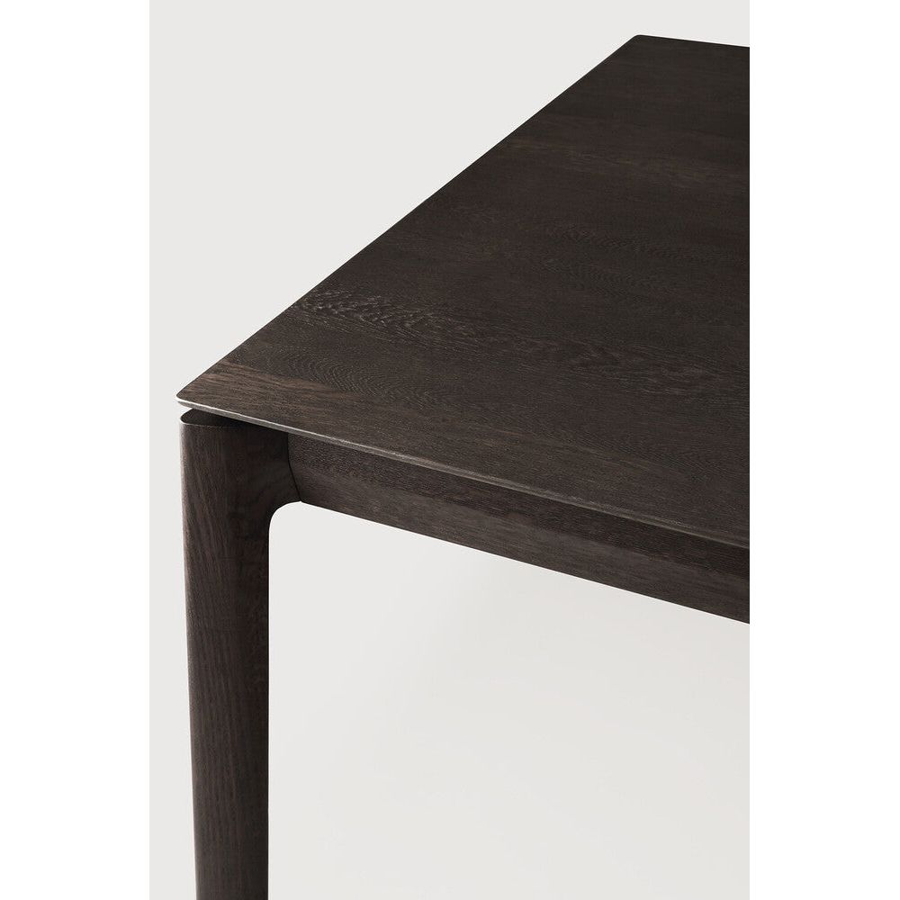 Featuring Bok Varnished Oak Brown Dining Table by Ethnicraft at Amethyst Home. Just like its matching chair, the Bok dining table has become one of our signature designs. Its airy shape yet rock solid construction make this piece a timeless and remarkable design to enjoy for years to come.Collection : BokExtendable : NoFinish : VarnishedFloor Protector : YesMain Material : Oa. Amethyst Home provides interior design, new construction, custom furniture, and area rugs in the Salt Lake City metro area