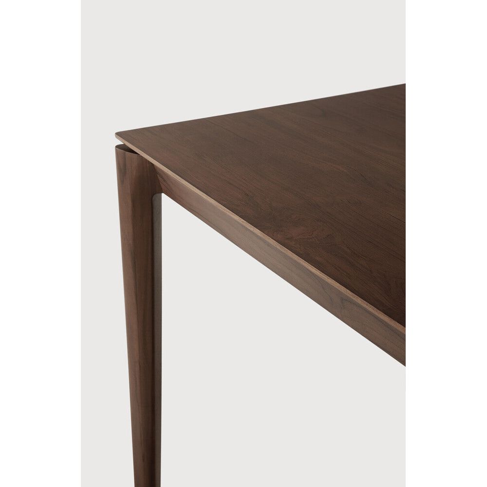 Featuring Bok Varnished Teak Brown Dining Table by Ethnicraft at Amethyst Home. Reminiscent of a goat's curved horns, the Bok collection combines sculptural elegance and contemporary crafting into a graceful and airy form. Just like its matching chair, the Bok dining table has become one of our signature designs. A timeless design to enjoy for years to come.Adjustable Feet : NoBr. Amethyst Home provides interior design, new construction, custom furniture, and area rugs in the Alpharetta metro area
