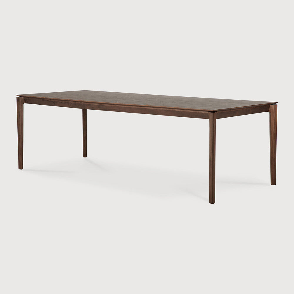 Featuring Bok Varnished Teak Brown Dining Table by Ethnicraft at Amethyst Home. Reminiscent of a goat's curved horns, the Bok collection combines sculptural elegance and contemporary crafting into a graceful and airy form. Just like its matching chair, the Bok dining table has become one of our signature designs. A timeless design to enjoy for years to come.Adjustable Feet : NoBru. Amethyst Home provides interior design, new construction, custom furniture, and area rugs in the Charlotte metro area