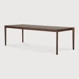 Featuring Bok Varnished Teak Brown Dining Table by Ethnicraft at Amethyst Home. Reminiscent of a goat's curved horns, the Bok collection combines sculptural elegance and contemporary crafting into a graceful and airy form. Just like its matching chair, the Bok dining table has become one of our signature designs. A timeless design to enjoy for years to come.Adjustable Feet : NoBru. Amethyst Home provides interior design, new construction, custom furniture, and area rugs in the Charlotte metro area