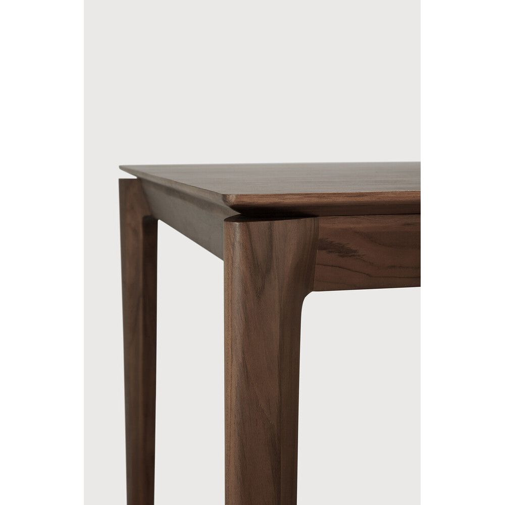 Featuring Bok Varnished Teak Brown Dining Table by Ethnicraft at Amethyst Home. Reminiscent of a goat's curved horns, the Bok collection combines sculptural elegance and contemporary crafting into a graceful and airy form. Just like its matching chair, the Bok dining table has become one of our signature designs. A timeless design to enjoy for years to come.Adjustable Feet : NoBru. Amethyst Home provides interior design, new construction, custom furniture, and area rugs in the Park City metro area