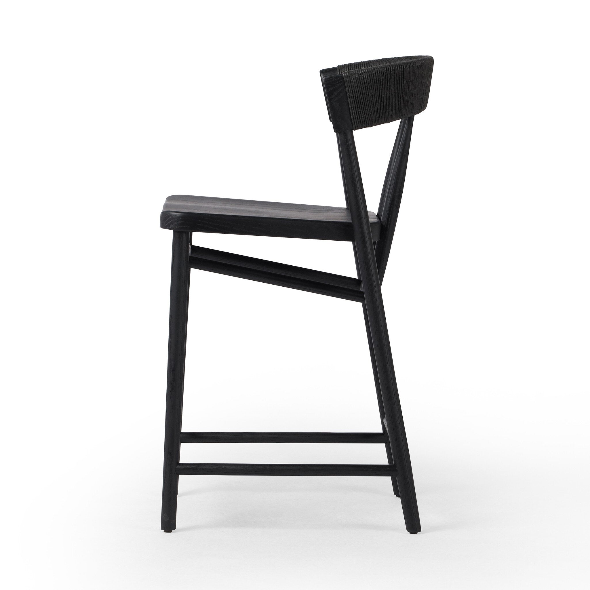 Featuring Buxton Black Rush Bar + Counter Stool by Four Hands at Amethyst Home. A solid oak counter stool defined by tapered legs and framing gives an updated look to the classic whistler chair. Finished with a paper rush wrapped detail on the back.BarOverall Dimensions: 19.25"w x 22.25"d x 42.75"hWeight: 23.70 lbsCounterOverall Dimensions: 19.50"w x 22.25"d x 38.75"hWeight: 21.6. Amethyst Home provides interior design, new construction, custom furniture, and area rugs in the Scottsdale metro area