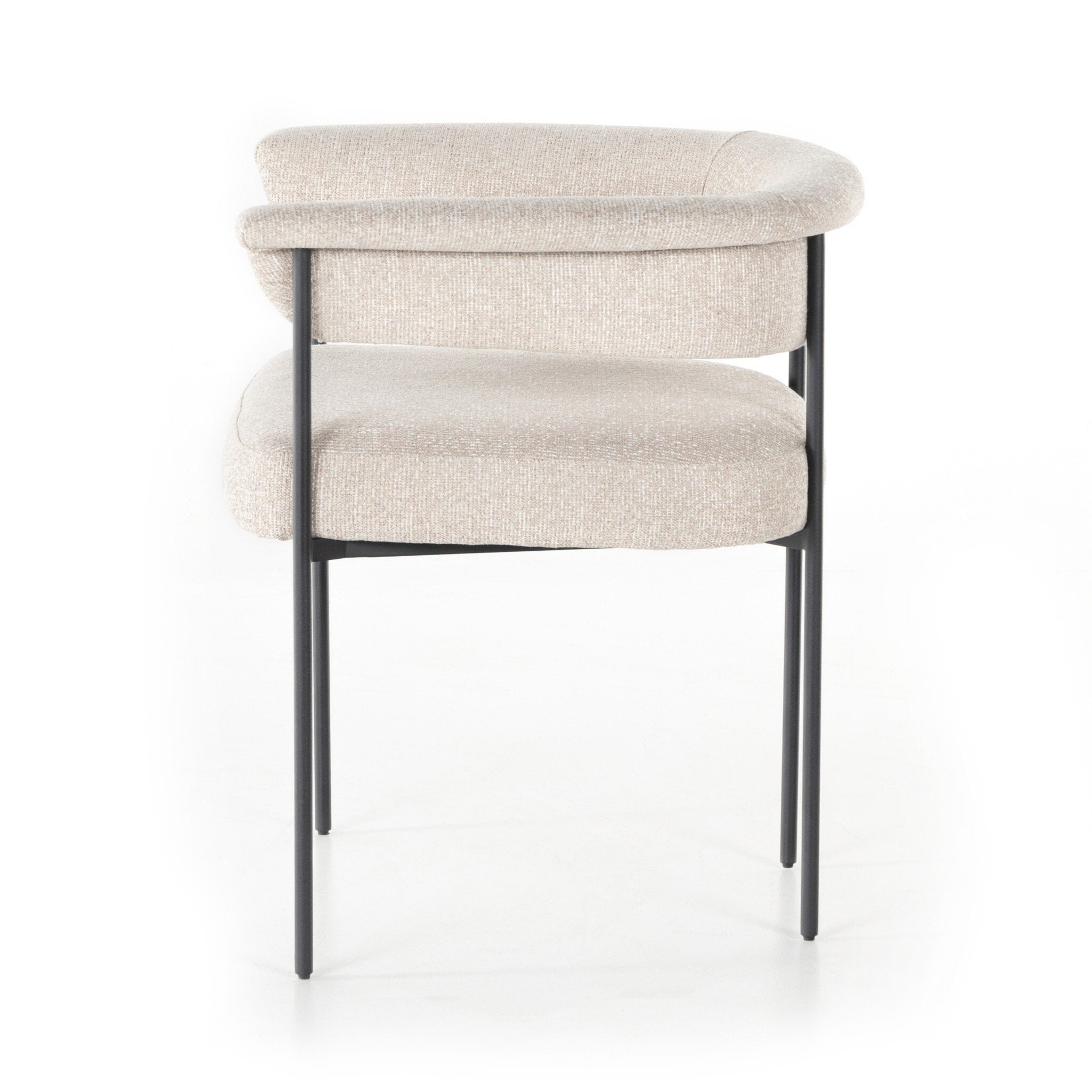 Featuring Carrie Light Camel Dining Chair by Four Hands at Amethyst Home. Airy and light with slim, black-finished iron framing, camel-colored upholstery lends texture to a beautifully sculpted dining style featuring a yoke back and exterior fold detailing.Overall Dimensions: 25.50"w x 23.00"d x 27.50"hWeight : 29.54 lbsMaterials : 100% Polyester, Iron, Poplar Plywood. Amethyst Home provides interior design, new construction, custom furniture, and area rugs in the Charlotte metro area