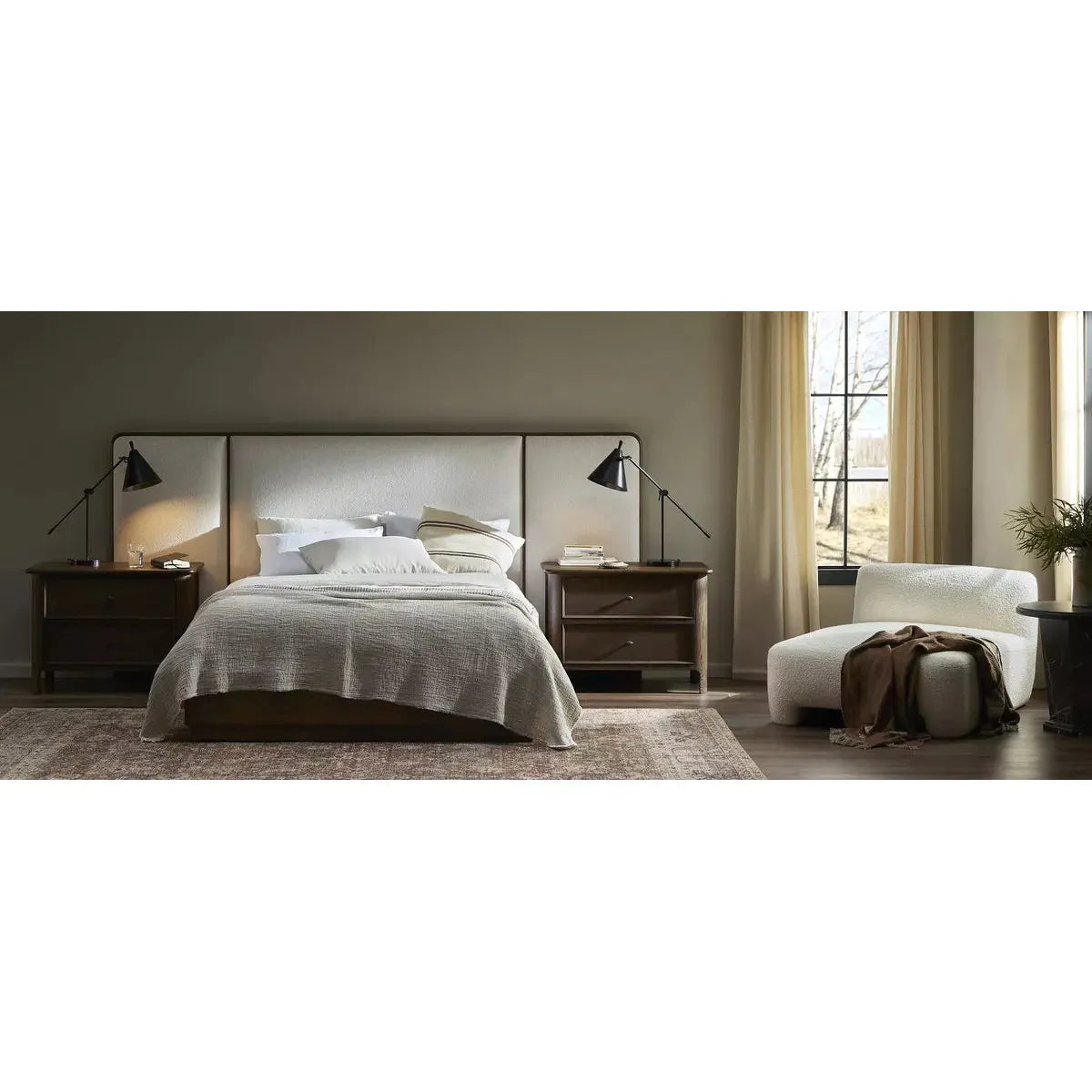 A plush, winged headboard adds dramatic scale and inviting comfort to this modern bed. Thick rails and a footboard with a plinth base have a rustic finish. Amethyst Home provides interior design, new home construction design consulting, vintage area rugs, and lighting in the Washington metro area.