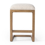 Featuring Finn Somerton Ash Bar + Counter Stool by Four Hands at Amethyst Home. A stunner from every angle, this architecturally inspired counter stool features an angular base crafted from solid ash with two iron rods for added support and visual interest. Seat is upholstered in a linen/cotton/poly blend performance fabric with subtle texture throughout. Performance fabrics are spec. Amethyst Home provides interior design, new construction, custom furniture, and area rugs in the Dallas metro area