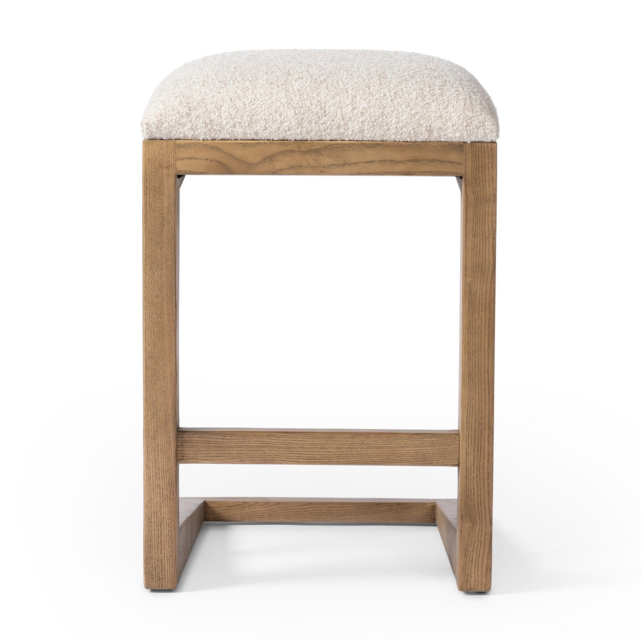 Featuring Finn Somerton Ash Bar + Counter Stool by Four Hands at Amethyst Home. A stunner from every angle, this architecturally inspired counter stool features an angular base crafted from solid ash with two iron rods for added support and visual interest. Seat is upholstered in a linen/cotton/poly blend performance fabric with subtle texture throughout. Performance fabrics are spec. Amethyst Home provides interior design, new construction, custom furniture, and area rugs in the Dallas metro area