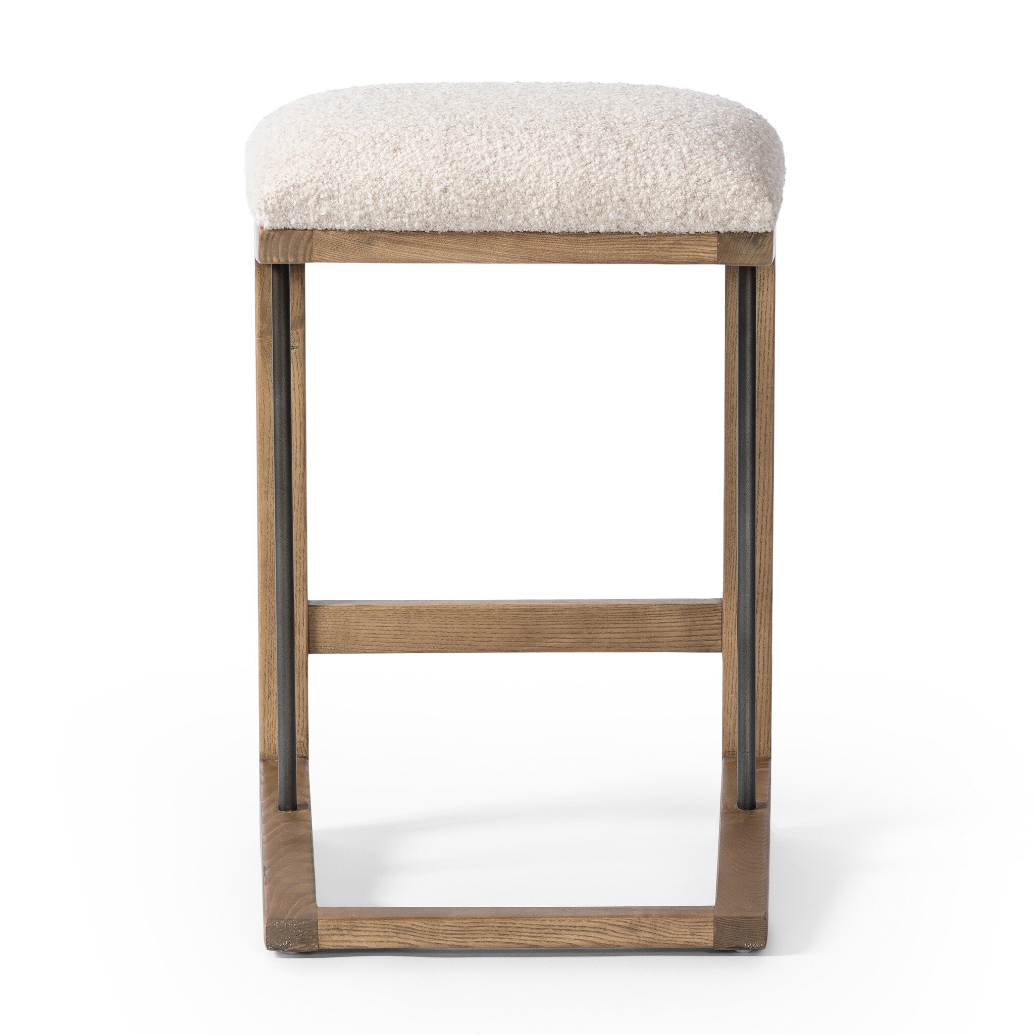 Featuring Finn Somerton Ash Bar + Counter Stool by Four Hands at Amethyst Home. A stunner from every angle, this architecturally inspired counter stool features an angular base crafted from solid ash with two iron rods for added support and visual interest. Seat is upholstered in a linen/cotton/poly blend performance fabric with subtle texture throughout. Performance fabrics are . Amethyst Home provides interior design, new construction, custom furniture, and area rugs in the Scottsdale metro area