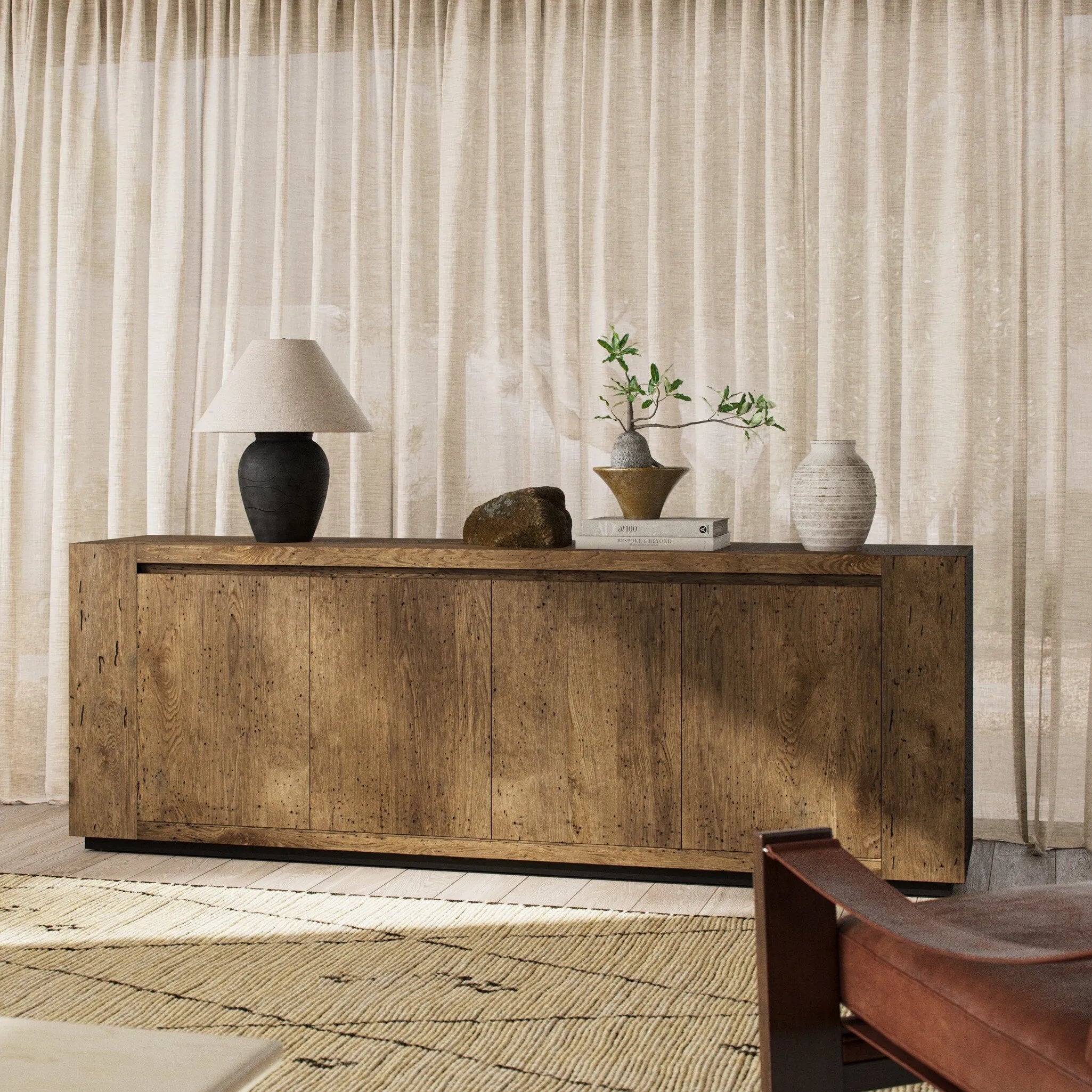 Made from thick-cut oak veneer with a faux rustic finish made to emulate wormwood, this low, large-scale sideboard features chunky squared legs and dovetail joinery detailing.As lovers of modern materials at Amethyst, we love the nature inspired Abaso Sideboard - Rustic Wormwood Oak. Amethyst Home provides interior design, new home construction design consulting, vintage area rugs, and lighting in the Boston metro area.