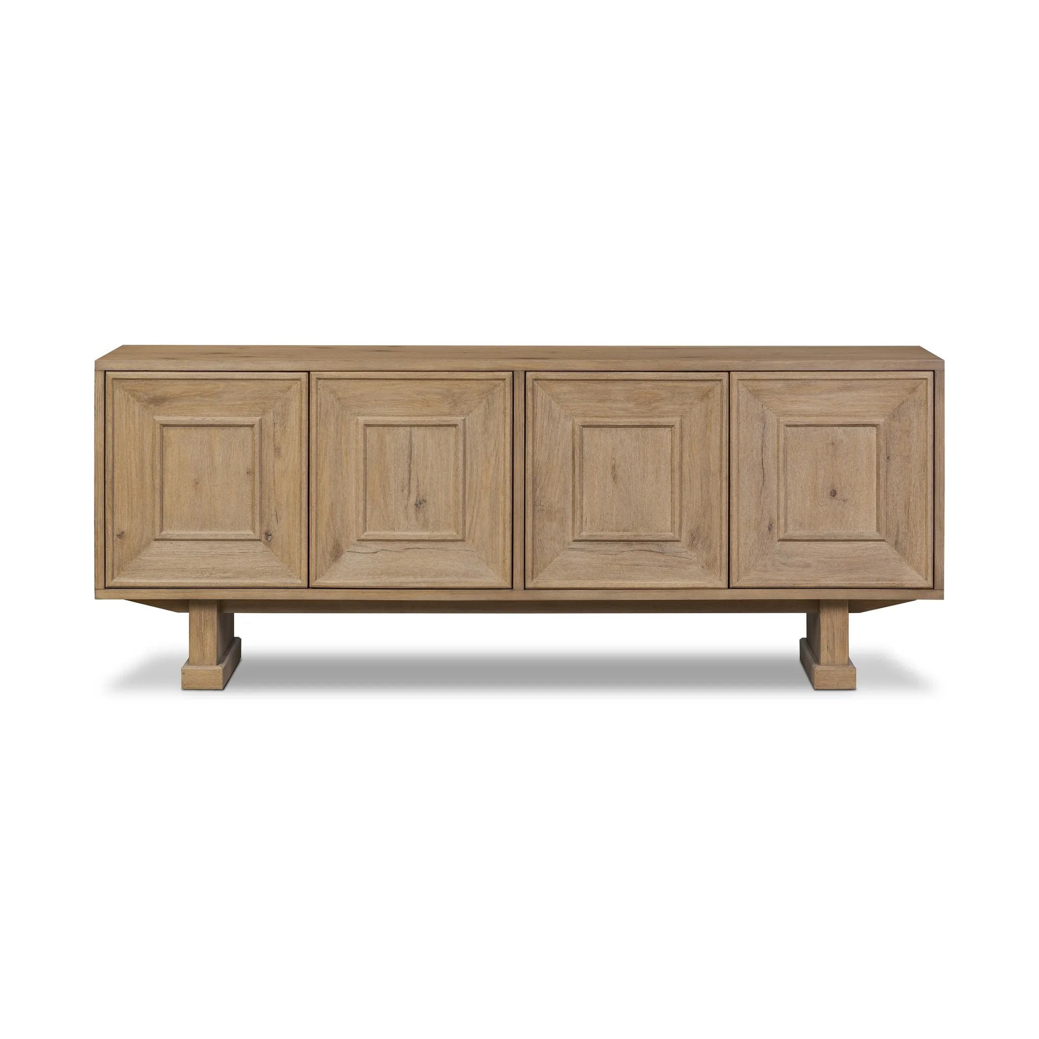 Store favorite dinnerware, table linens and more in this modernized Deco sideboard, with inverted chamfered framing and molding around the doors. Made from solid oak with a light, drifted finish and ski-style legs that elevate the whole piece Amethyst Home provides interior design, new home construction design consulting, vintage area rugs, and lighting in the Austin metro area.