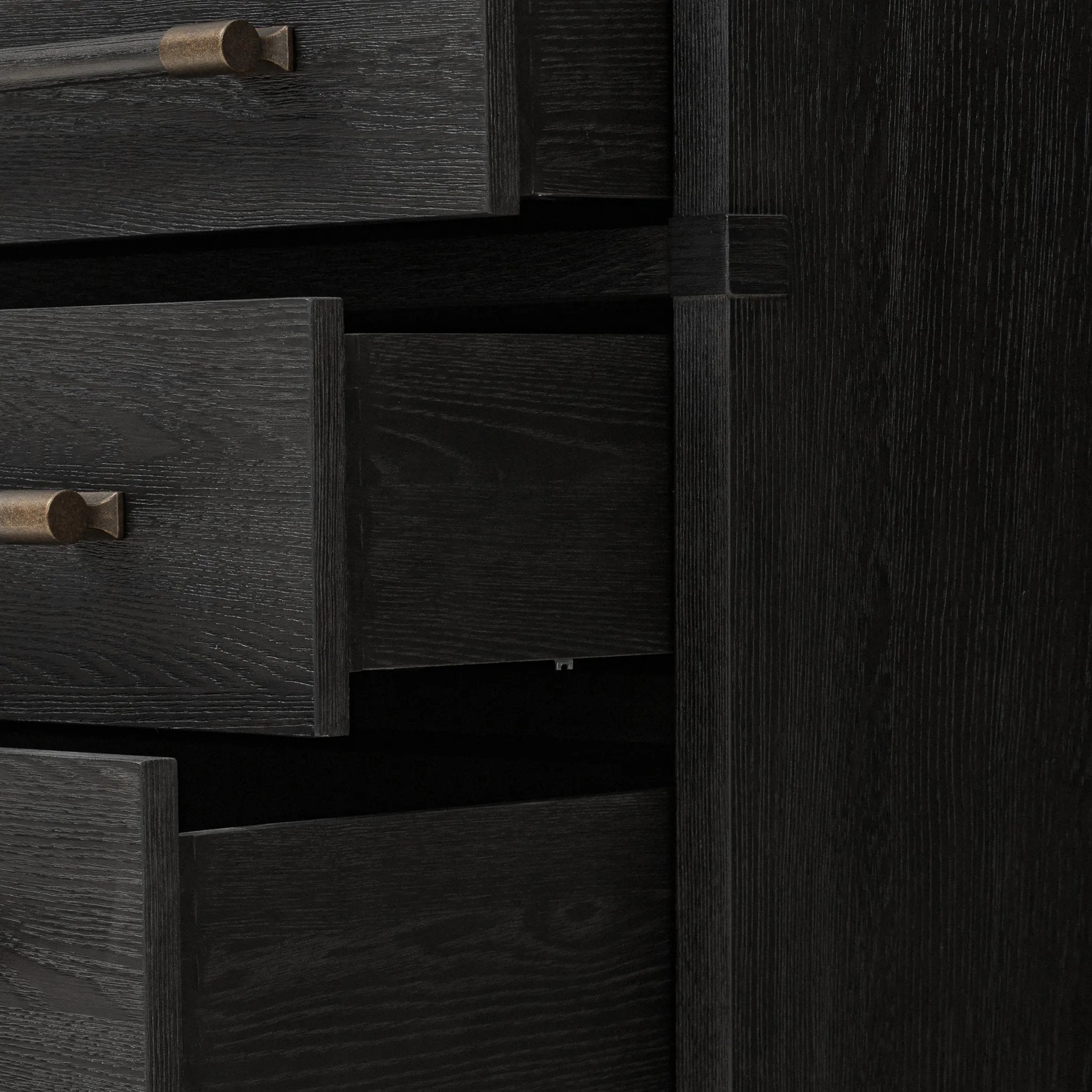 Featuring Adolfo Modern Black Ash Nightstand by Four Hands at Amethyst Home. Beautifully minimalist. A three-drawer dresser made from black-finished ash  features long, linear bronzed hardware for a smooth, clean look.Overall Dimensions: 32.00"w x 20.50"d x 26.25"hWeight : 114.64 lbsMaterials: Ash Veneer, Solid Ash. Amethyst Home provides interior design, new home construction design consulting, vintage area rugs, and lighting in the Boston metro area.