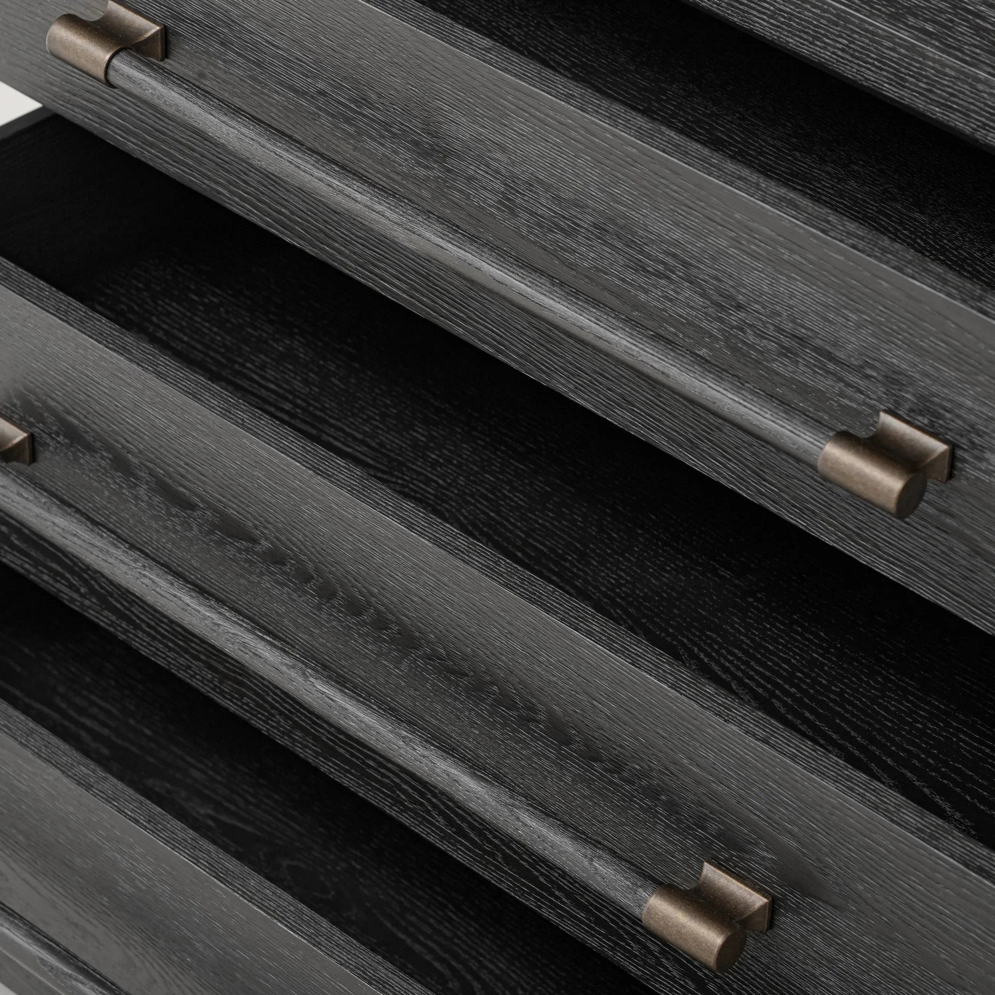 Featuring Adolfo Modern Black Ash Nightstand by Four Hands at Amethyst Home. Beautifully minimalist. A three-drawer dresser made from black-finished ash  features long, linear bronzed hardware for a smooth, clean look.Overall Dimensions: 32.00"w x 20.50"d x 26.25"hWeight : 114.64 lbsMaterials: Ash Veneer, Solid Ash. Amethyst Home provides interior design, new home construction design consulting, vintage area rugs, and lighting in the Dallas metro area.