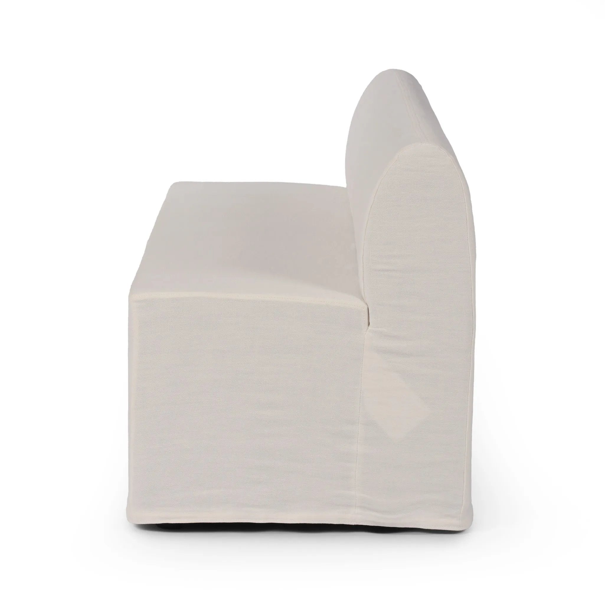 Featuring Ainsworth Broadway Snow Slipcover Dining Bench by Four Hands at Amethyst Home. A sculptural shape with clean lines and oversized dome-shaped arms. Tight construction allows a fully removable, machine-washable slipcover to drape over the entire piece. Slipcover is handmade from a natural, resilient white 100% flax/linen blend; attaches to the frame wit. Amethyst Home provides interior design, new home construction design consulting, vintage area rugs, and lighting in the Tampa metro area.