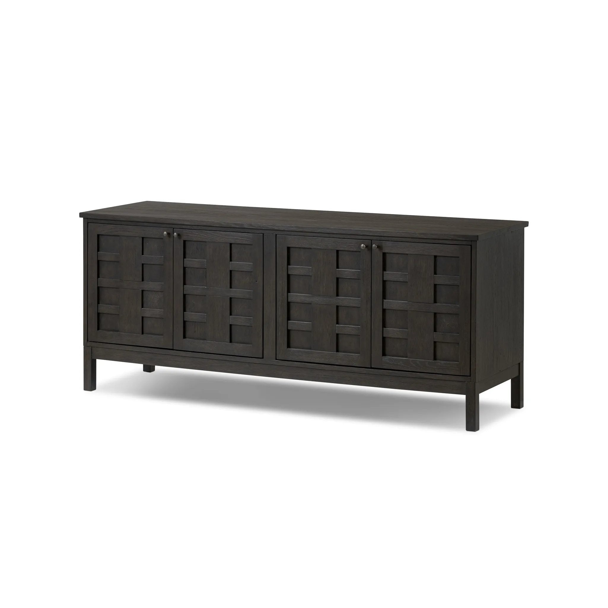 A transitional piece that works into your collection with ease. This solid oak sideboard is finished in a smoked black, highlighting natural graining inherent to rich character woods. Grid-like patterned doors bring dimension to clean, simple shaping, while interior shelving awaits storage of dinnerware, table linens and more. Amethyst Home provides interior design, new home construction design consulting, vintage area rugs, and lighting in the Laguna Beach metro area.