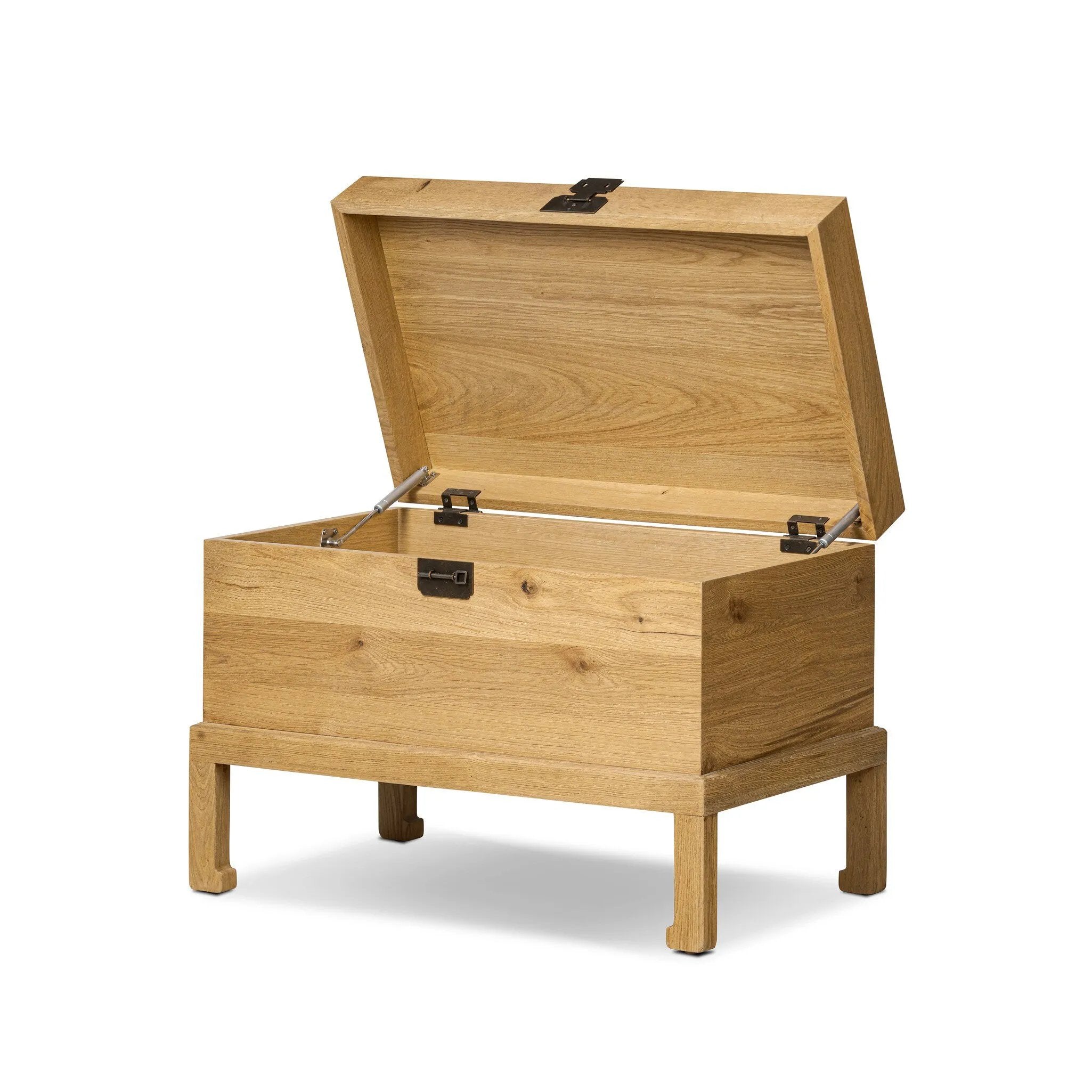 Inspired by classic Chinese antiques, this heritage-style trunk blends timeless design with modern functionality. Crafted from oak with a light, toasted finish, bronzed latch-and-key hardware adds a playful design detail Amethyst Home provides interior design, new home construction design consulting, vintage area rugs, and lighting in the Calabasas metro area.
