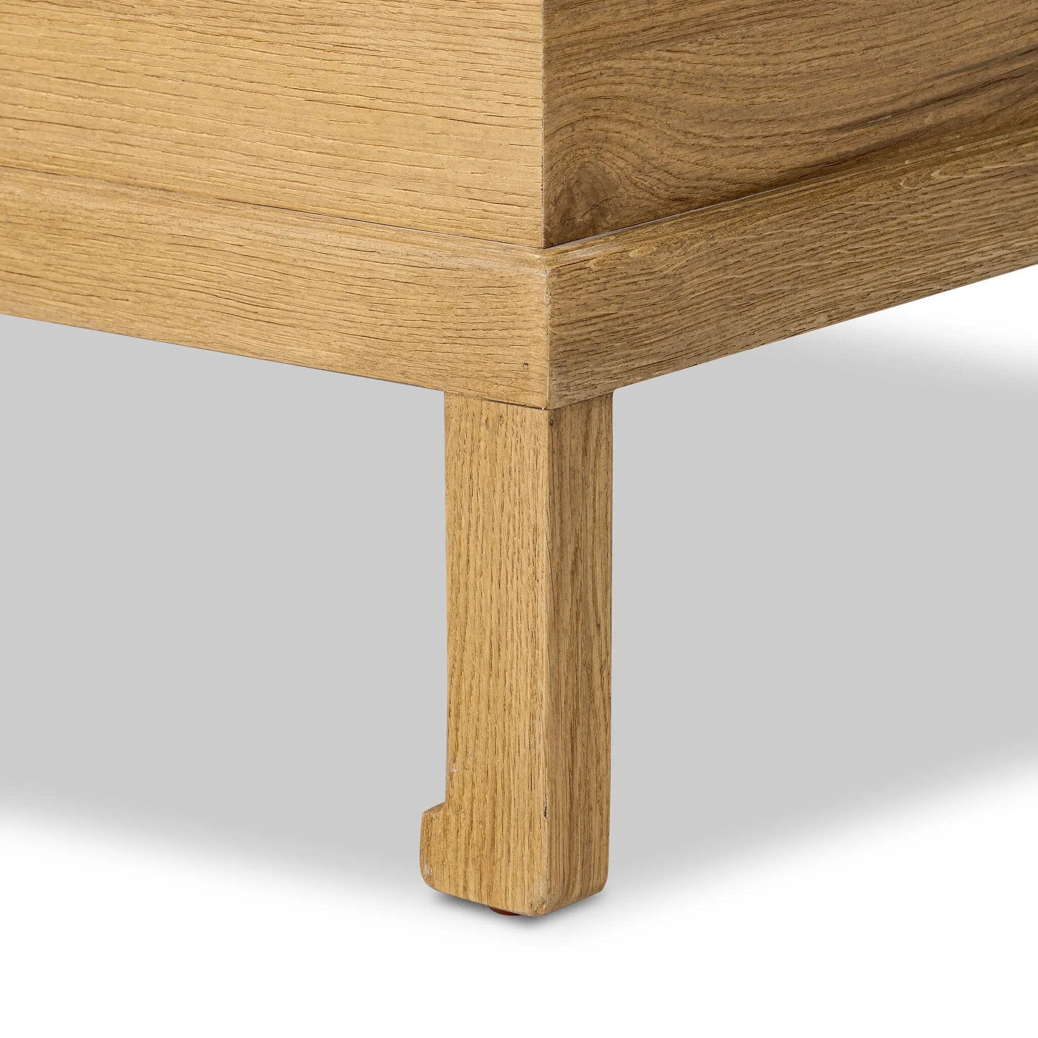 Inspired by classic Chinese antiques, this heritage-style trunk blends timeless design with modern functionality. Crafted from oak with a light, toasted finish, bronzed latch-and-key hardware adds a playful design detail Amethyst Home provides interior design, new home construction design consulting, vintage area rugs, and lighting in the Charlotte metro area.