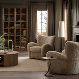 Relax into the curved arms and subtle wing back shape of this classic reading chair. Upholstered in an ethically sourced, natural beige shearling for extra comfort and texture. Crafted with S-spring suspension, a loose cushion and hidden legs beneath Amethyst Home provides interior design, new home construction design consulting, vintage area rugs, and lighting in the Calabasas metro area.