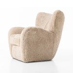 Relax into the curved arms and subtle wing back shape of this classic reading chair. Upholstered in an ethically sourced, natural beige shearling for extra comfort and texture. Crafted with S-spring suspension, a loose cushion and hidden legs beneath Amethyst Home provides interior design, new home construction design consulting, vintage area rugs, and lighting in the Monterey metro area.