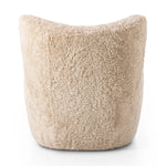 Relax into the curved arms and subtle wing back shape of this classic reading chair. Upholstered in an ethically sourced, natural beige shearling for extra comfort and texture. Crafted with S-spring suspension, a loose cushion and hidden legs beneath Amethyst Home provides interior design, new home construction design consulting, vintage area rugs, and lighting in the Nashville metro area.