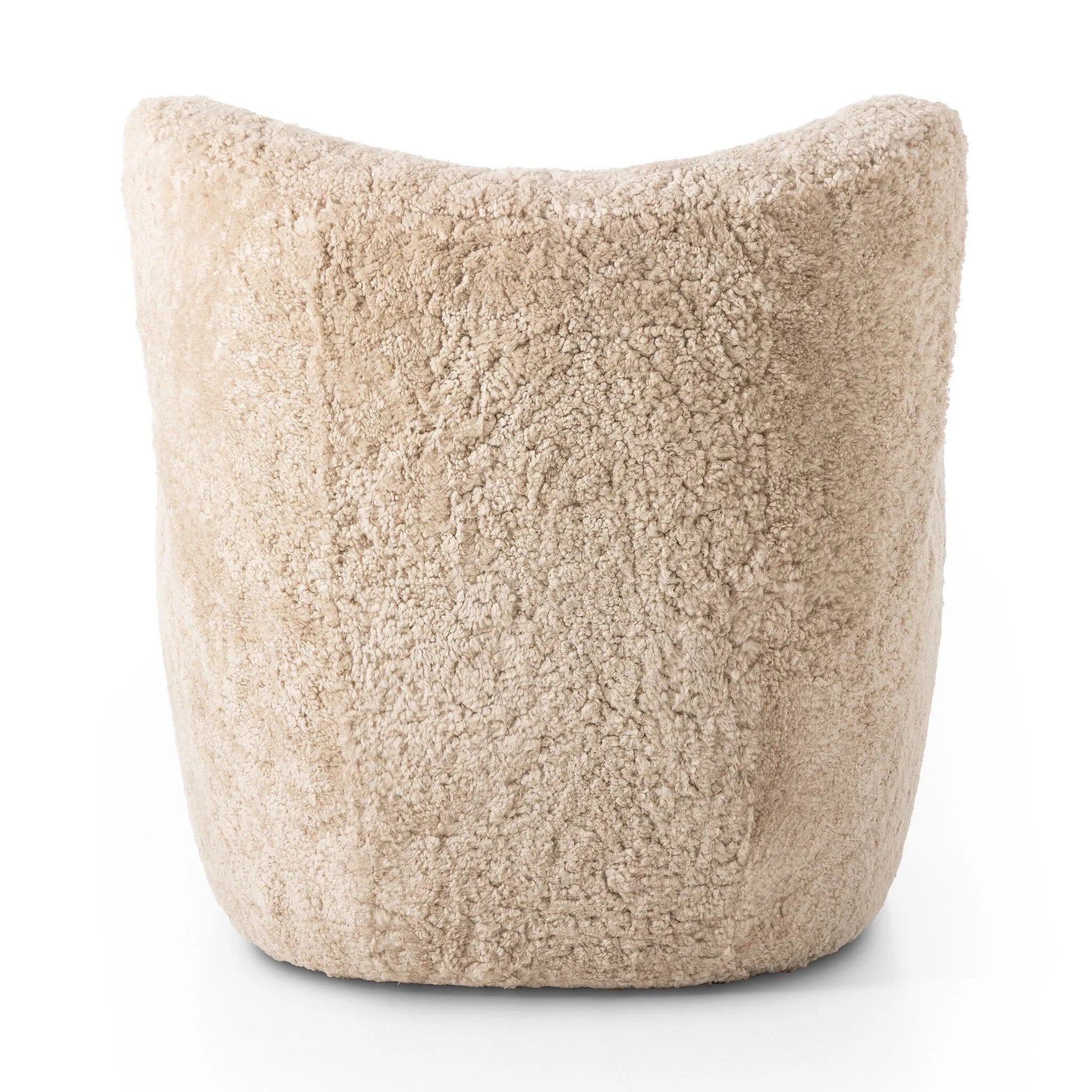 Relax into the curved arms and subtle wing back shape of this classic reading chair. Upholstered in an ethically sourced, natural beige shearling for extra comfort and texture. Crafted with S-spring suspension, a loose cushion and hidden legs beneath Amethyst Home provides interior design, new home construction design consulting, vintage area rugs, and lighting in the Nashville metro area.