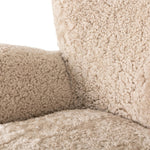 Relax into the curved arms and subtle wing back shape of this classic reading chair. Upholstered in an ethically sourced, natural beige shearling for extra comfort and texture. Crafted with S-spring suspension, a loose cushion and hidden legs beneath Amethyst Home provides interior design, new home construction design consulting, vintage area rugs, and lighting in the Newport Beach metro area.