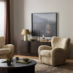 Relax into the curved arms and subtle wing back shape of this classic reading chair. Upholstered in an ethically sourced, natural beige shearling for extra comfort and texture. Crafted with S-spring suspension, a loose cushion and hidden legs beneath Amethyst Home provides interior design, new home construction design consulting, vintage area rugs, and lighting in the Portland metro area.
