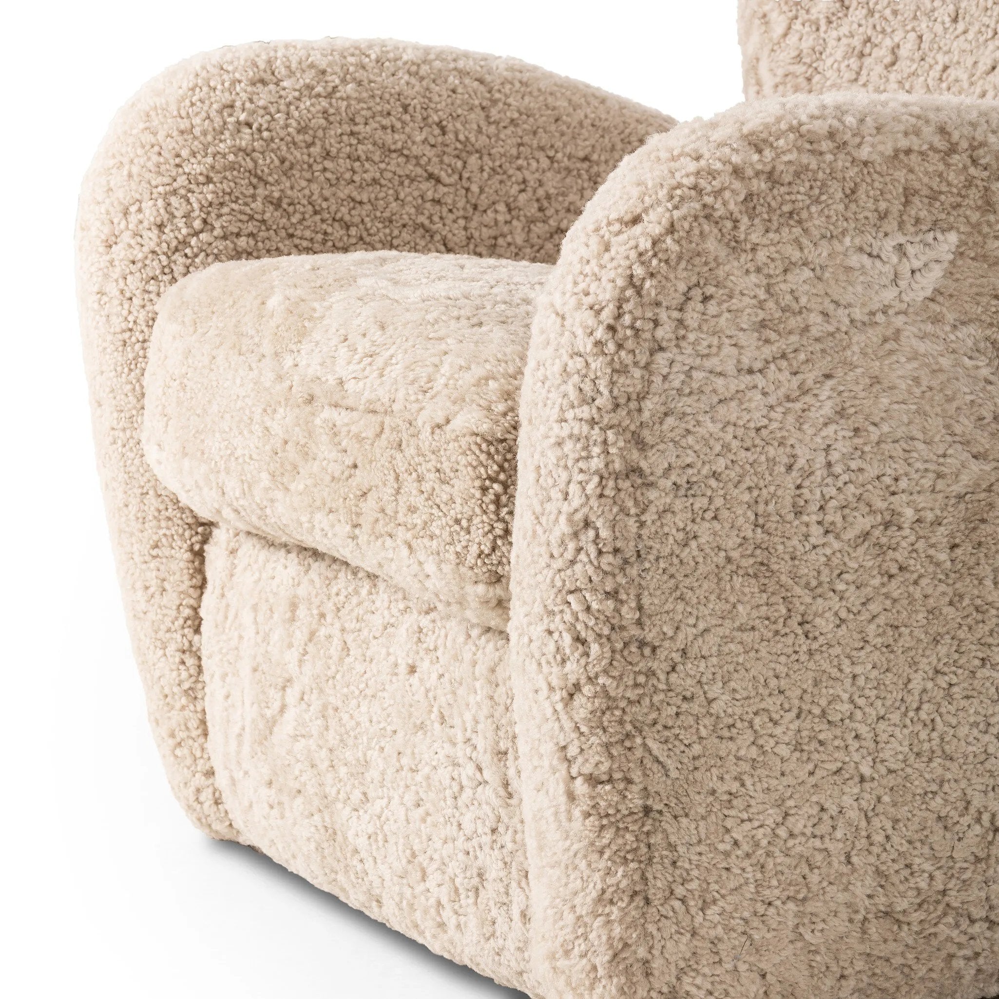 Relax into the curved arms and subtle wing back shape of this classic reading chair. Upholstered in an ethically sourced, natural beige shearling for extra comfort and texture. Crafted with S-spring suspension, a loose cushion and hidden legs beneath Amethyst Home provides interior design, new home construction design consulting, vintage area rugs, and lighting in the Scottsdale metro area.