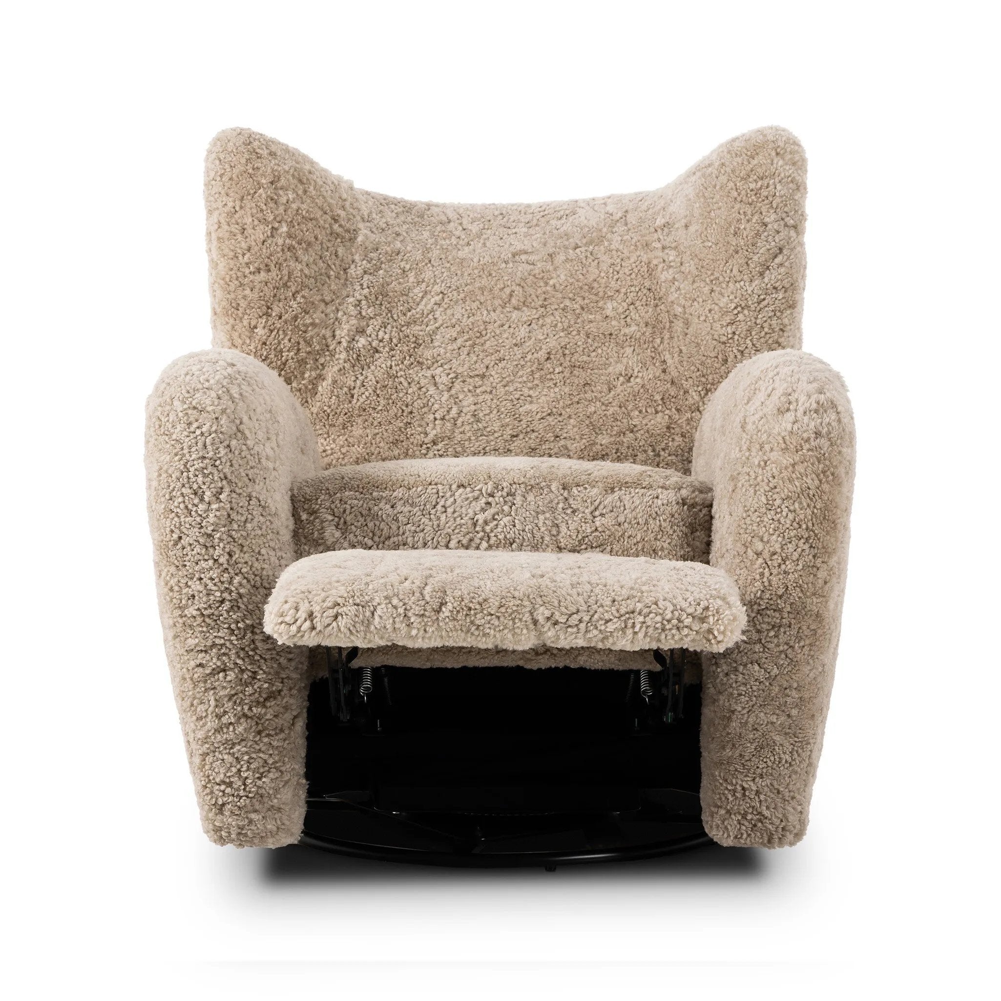 Relax into the curved arms and subtle wingback shape of this classic reading chair, featuring a reclining mechanism for ultimate comfort. Upholstered in an ethically sourced, natural beige shearling for extra comfort and texture. Crafted with S-spring suspension, a loose cushion and hidden legs beneath. Amethyst Home provides interior design, new home construction design consulting, vintage area rugs, and lighting in the Dallas metro area.