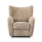 Relax into the curved arms and subtle wingback shape of this classic reading chair, featuring a reclining mechanism for ultimate comfort. Upholstered in an ethically sourced, natural beige shearling for extra comfort and texture. Crafted with S-spring suspension, a loose cushion and hidden legs beneath. Amethyst Home provides interior design, new home construction design consulting, vintage area rugs, and lighting in the Houston metro area.