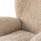 Relax into the curved arms and subtle wingback shape of this classic reading chair, featuring a reclining mechanism for ultimate comfort. Upholstered in an ethically sourced, natural beige shearling for extra comfort and texture. Crafted with S-spring suspension, a loose cushion and hidden legs beneath. Amethyst Home provides interior design, new home construction design consulting, vintage area rugs, and lighting in the Nashville metro area.