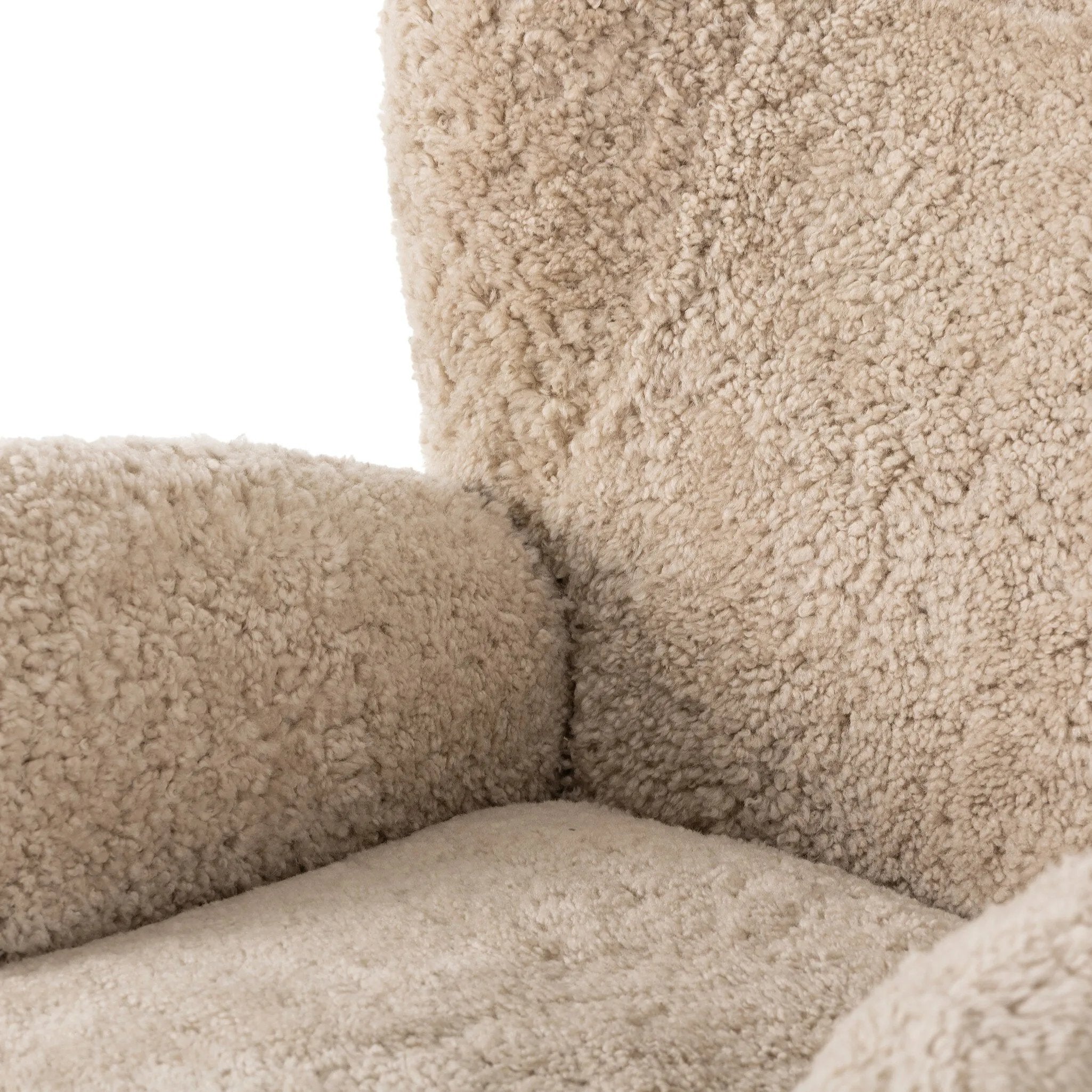 Relax into the curved arms and subtle wingback shape of this classic reading chair, featuring a reclining mechanism for ultimate comfort. Upholstered in an ethically sourced, natural beige shearling for extra comfort and texture. Crafted with S-spring suspension, a loose cushion and hidden legs beneath. Amethyst Home provides interior design, new home construction design consulting, vintage area rugs, and lighting in the Nashville metro area.