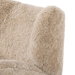 Relax into the curved arms and subtle wingback shape of this classic reading chair, featuring a reclining mechanism for ultimate comfort. Upholstered in an ethically sourced, natural beige shearling for extra comfort and texture. Crafted with S-spring suspension, a loose cushion and hidden legs beneath. Amethyst Home provides interior design, new home construction design consulting, vintage area rugs, and lighting in the Portland metro area.