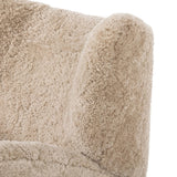 Relax into the curved arms and subtle wingback shape of this classic reading chair, featuring a reclining mechanism for ultimate comfort. Upholstered in an ethically sourced, natural beige shearling for extra comfort and texture. Crafted with S-spring suspension, a loose cushion and hidden legs beneath. Amethyst Home provides interior design, new home construction design consulting, vintage area rugs, and lighting in the Portland metro area.
