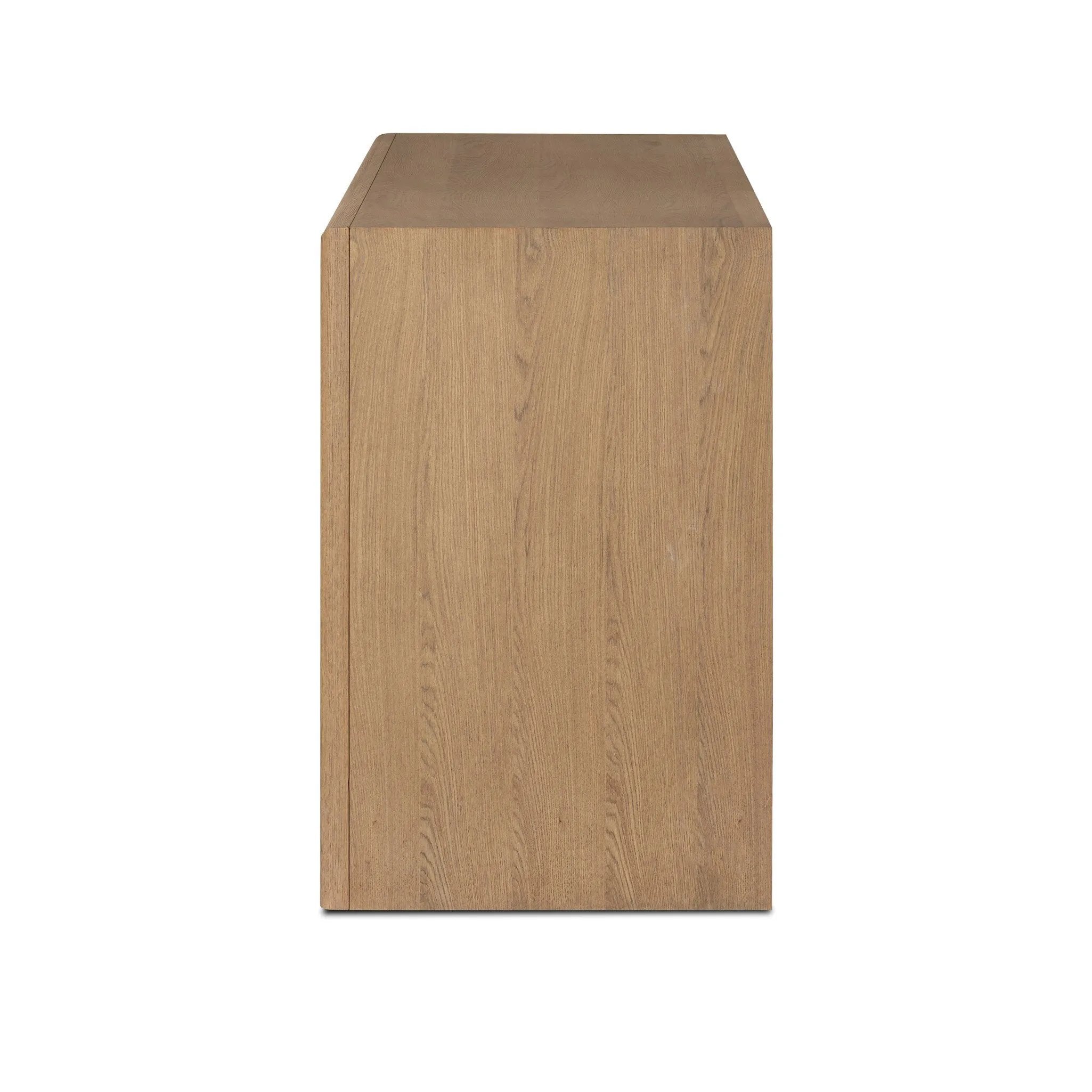 Crafted from sandy solid oak in a waterfall silhouette, this dresser adds a touch of contemporary simplicity to your bedroom. A bullnose edge and oval iron drawer pulls add variety.As lovers of natural design at Amethyst, we love the designer inspired Analisa 6 Drawer Dresser - Sandy Oak. Amethyst Home provides interior design, new home construction design consulting, vintage area rugs, and lighting in the Newport Beach metro area.