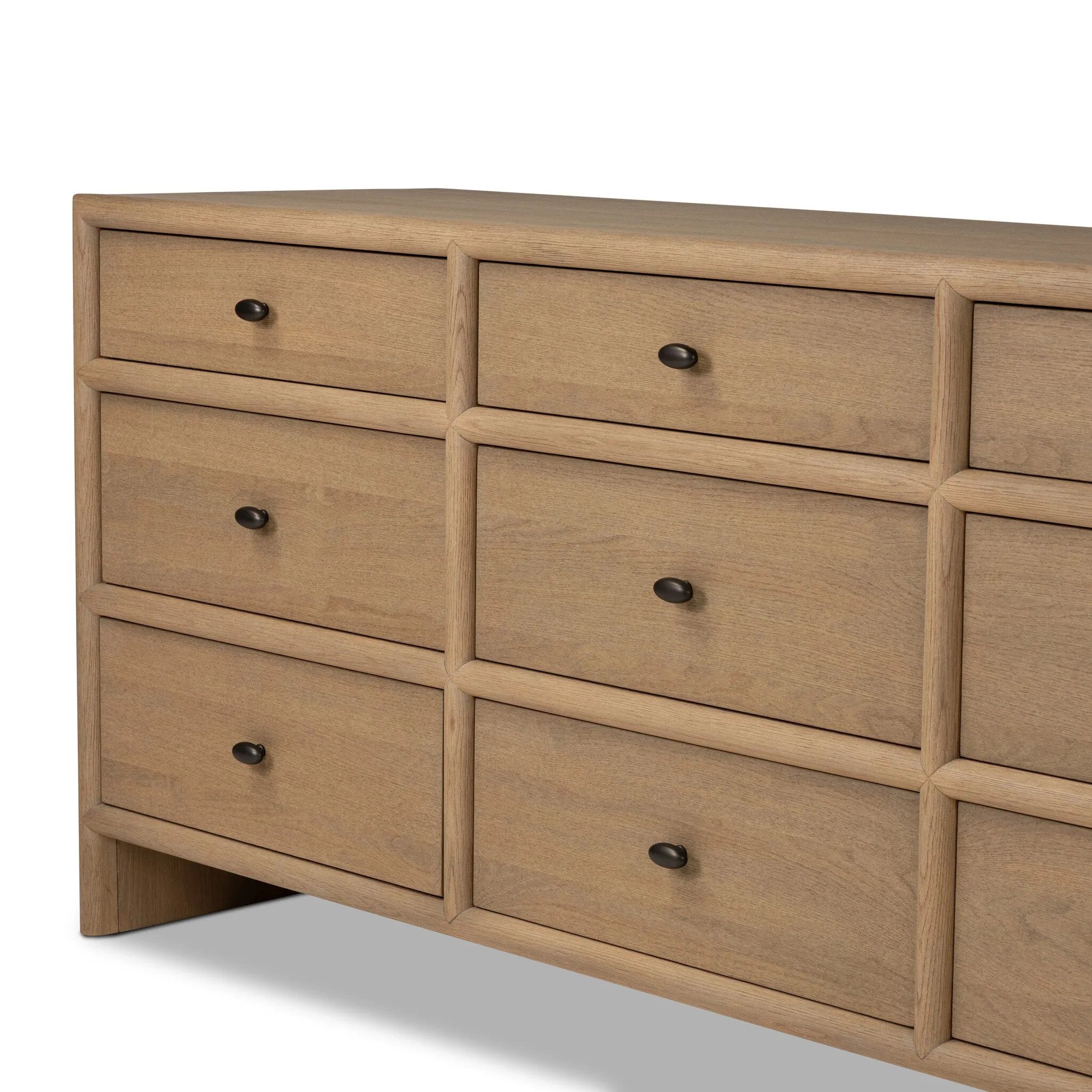 Crafted from sandy solid oak in a waterfall silhouette, this storage-driven dresser adds a touch of contemporary simplicity to your bedroom. A bullnose edge and oval iron drawer pulls add variety.As enthusiasts of modern design at Amethyst, we love the designer inspired Analisa 9 Drawer Dresser - Sandy Oak. Amethyst Home provides interior design, new home construction design consulting, vintage area rugs, and lighting in the Dallas metro area.